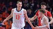 Feb 2, 2025; Champaign, Illinois, USA; Illinois Fighting Illini center Tomislav Ivisic (13) gets a hand from teammate Kasparas Jakucionis (32) during the second half at State Farm Center. Mandatory Credit: Ron Johnson-Imagn Images