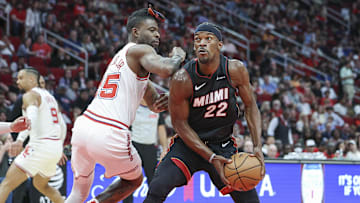 Apr 5, 2024; Houston, Texas, USA; Miami Heat forward Jimmy Butler (22) drives towards the basket as Houston Rockets forward Reggie Bullock Jr. (25) defends during the third quarter at Toyota Center. Mandatory Credit: Troy Taormina-Imagn Images
