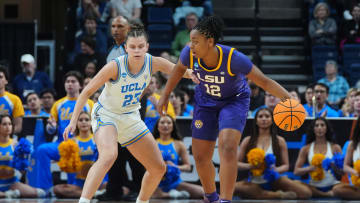 Mar 30, 2024; Albany, NY, USA; LSU Tigers guard Mikaylah Williams (12) dribbles the ball against UCLA Bruins forward Gabriela Jaquez (23) during the first half in the semifinals of the Albany Regional of the 2024 NCAA Tournament at MVP Arena. Mandatory Credit: Gregory Fisher-USA TODAY Sports