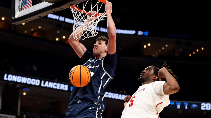 Mar 22, 2024; Memphis, TN, USA;  Longwood Lancers center Szymon Zapala (12) dunks the ball against