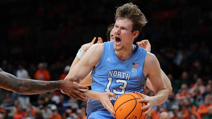 Feb 10, 2026; Coral Gables, Florida, USA; North Carolina Tar Heels center Henri Veesaar (13) grabs a rebound against the Miami Hurricanes during the first half at Watsco Center. Mandatory Credit: Sam Navarro-Imagn Images
