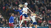 Nov 30, 2024; London, England;  England forward Alessia Russo (9) wins the header against United states defender Emily Sonnett (14) in the second  half of an International friendly at Wembley Stadium. 