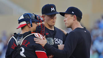 Aug 31, 2024; Minneapolis, Minnesota, USA; Minnesota Twins catcher Christian Vazquez (8) and starting pitcher Zebby Matthews (52) listen to pitching coach Pete Maki during a difficult first inning with the Toronto Blue Jays at Target Field. Mandatory Credit: Bruce Kluckhohn-Imagn Images