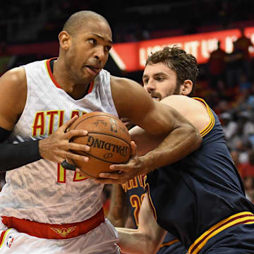 May 6, 2016; Atlanta, GA, USA; Atlanta Hawks center Al Horford (15) and Cleveland Cavaliers forward Kevin Love (0) battle under the basket during the first half in game three of the second round of the NBA Playoffs at Philips Arena. Mandatory Credit: Dale Zanine-Imagn Images