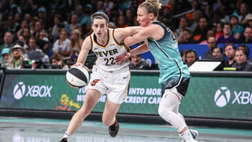 Jun 2, 2024; Brooklyn, New York, USA;  Indiana Fever guard Caitlin Clark (22) looks to drive past New York Liberty guard Courtney Vandersloot (22) in the second quarter at Barclays Center. Mandatory Credit: Wendell Cruz-USA TODAY Sports