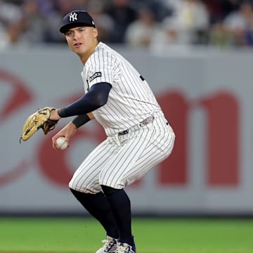Jun 16, 2025; Bronx, New York, USA; New York Yankees shortstop Anthony Volpe (11) throws out Los Angeles Angels center fielder Jo Adell (not pictured) on a ground ball during the eighth inning at Yankee Stadium. Mandatory Credit: Brad Penner-Imagn Images