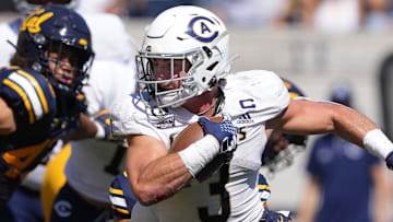 Aug 31, 2024; Berkeley, California, USA; UC Davis Aggies running back Lan Larison (3) carries the ball against the California Golden Bears during the second quarter at California Memorial Stadium. Mandatory Credit: Darren Yamashita-Imagn Images