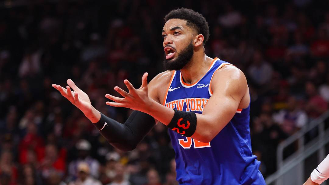 New York Knicks center Karl-Anthony Towns (32) reacts to a call against the Atlanta Hawks in the second quarter during game six of the first round of the 2026 NBA Playoffs at State Farm Arena. 
