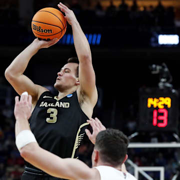Mar 23, 2024; Pittsburgh, PA, USA; Oakland Golden Grizzlies guard Jack Gohlke (3) shoots the ball against North Carolina State Wolfpack guard Michael O'Connell (12) during the first half in the second round of the 2024 NCAA Tournament at PPG Paints Arena.