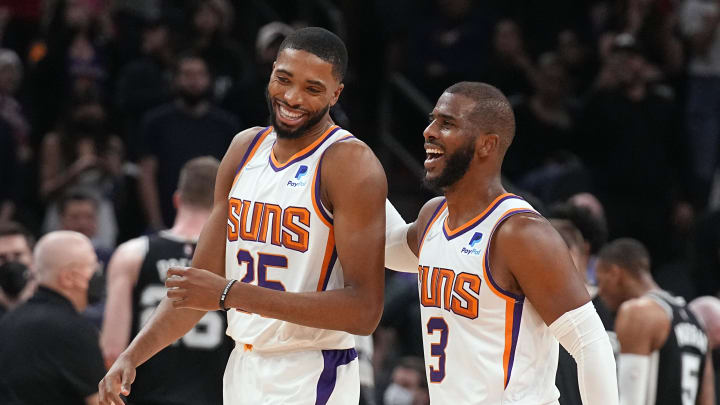 Dec 6, 2021; Phoenix, Arizona, USA; Phoenix Suns forward Mikal Bridges (25) and Chris Paul (3) celebrate against the San Antonio Spurs at Footprint Center. Mandatory Credit: Rick Scuteri-USA TODAY Sports