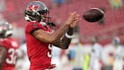 Aug 9, 2025; Tampa, Florida, USA; Tampa Bay Buccaneers wide receiver Emeka Egbuka (9) works out prior to the game against the Tennessee Titians at Raymond James Stadium. Mandatory Credit: Kim Klement Neitzel-Imagn Images