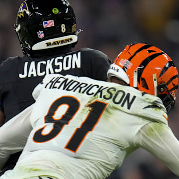 Cincinnati Bengals defensive end Trey Hendrickson (91) sacks Baltimore Ravens quarterback Lamar Jackson.