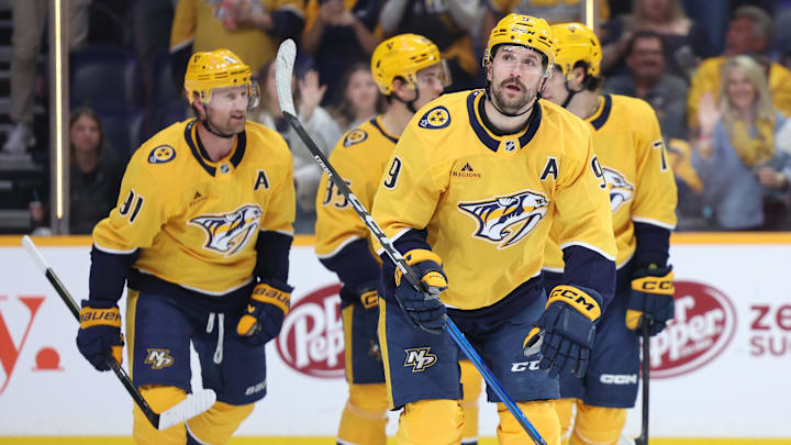 Apr 16, 2026; Nashville, Tennessee, USA; Nashville Predators left wing Filip Forsberg (9) regroups with his team after scoring a goal during the first period of their game against the Anaheim Ducks at Bridgestone Arena. Mandatory Credit: Alan Poizner-Imagn Images