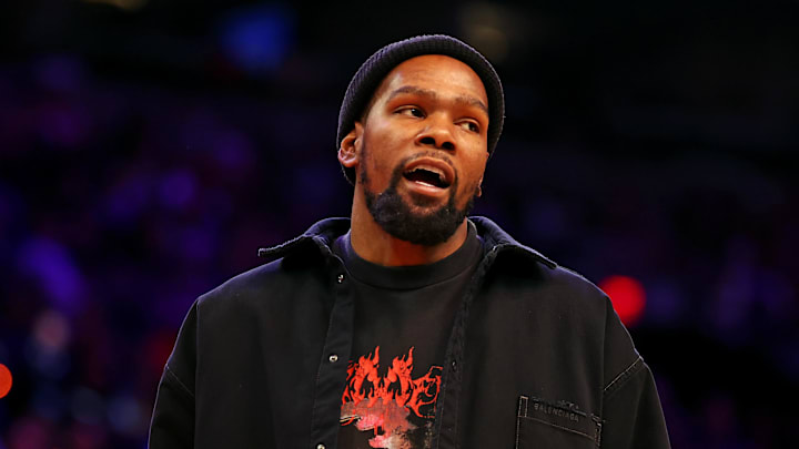 Nov 20, 2024; Phoenix, Arizona, USA; Phoenix Suns forward Kevin Durant looks on from the sidelines during the game between the Phoenix Suns and the New York Knicks at Footprint Center. Mandatory Credit: Mark J. Rebilas-Imagn Images