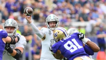 Sep 7, 2024; Seattle, Washington, USA; Eastern Michigan Eagles quarterback Cole Snyder (15) passes the ball against the Washington Huskies during the first half at Alaska Airlines Field at Husky Stadium. Mandatory Credit: Steven Bisig-Imagn Images