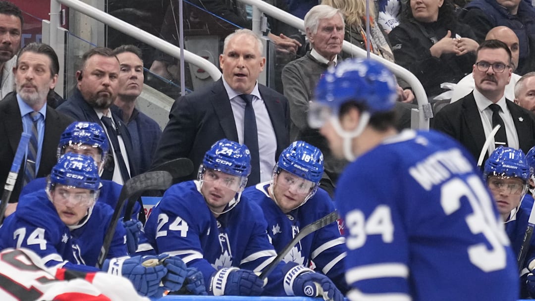 Apr 20, 2025; Toronto, Ontario, CAN; Toronto Maple Leafs head coach Craig Berube (center) watches the action during the third period of game one of the first round of the 2025 Stanley Cup Playoffs against the Ottawa Senators at Scotiabank Arena. Mandatory Credit: John E. Sokolowski-Imagn Images
