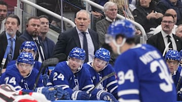 Apr 20, 2025; Toronto, Ontario, CAN; Toronto Maple Leafs head coach Craig Berube (center) watches the action during the third period of game one of the first round of the 2025 Stanley Cup Playoffs against the Ottawa Senators at Scotiabank Arena. Mandatory Credit: John E. Sokolowski-Imagn Images
