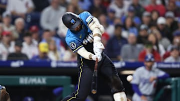 Apr 4, 2025; Philadelphia, Pennsylvania, USA; Philadelphia Phillies outfielder Nick Castellanos (8) hits a double against the Los Angeles Dodgers during the seventh inning at Citizens Bank Park. 