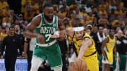 May 25, 2024; Indianapolis, Indiana, USA; Boston Celtics guard Jaylen Brown (7) and Indiana Pacers guard Andrew Nembhard (2) chase a loose ball during the fourth quarter of game three of the eastern conference finals in the 2024 NBA playoffs at Gainbridge Fieldhouse. Mandatory Credit: Trevor Ruszkowski-USA TODAY Sports