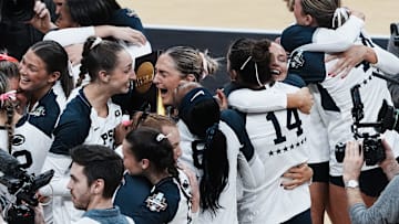 Penn State women's volleyball celebrates after defeating Louisville 3 sets to 1 to win the NCAA Championship Volleyball match at the KFC Yum! Center