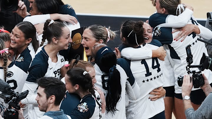 Penn State women's volleyball celebrates after defeating Louisville 3 sets to 1 to win the NCAA Championship Volleyball match at the KFC Yum! Center