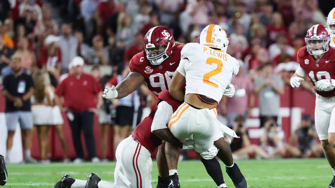 Oct 18, 2025; Tuscaloosa, Alabama, USA; Tennessee Volunteers running back Peyton Lewis (2) is tackled by Alabama Crimson Tide defensive back Keon Sabb (3) during the second quarter at Saban Field at Bryant-Denny Stadium. Mandatory Credit: David Leong-Imagn Images