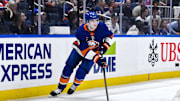 Apr 15, 2025; Elmont, New York, USA; New York Islanders defenseman Noah Dobson (8) skates with the puck during the third period against the Washington Capitals at UBS Arena. Mandatory Credit: John Jones-Imagn Images