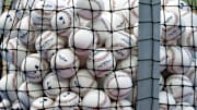 Apr 16, 2024; Miami, Florida, USA;  A bucket of baseballs sits on the field prior to the game between the San Francisco Giants against the Miami Marlins at loanDepot Park. Mandatory Credit: Rhona Wise-Imagn Images