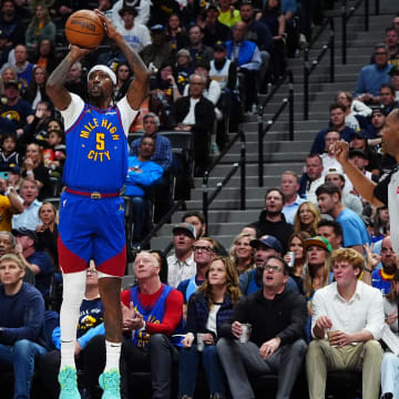 May 4, 2024; Denver, Colorado, USA; Denver Nuggets guard Kentavious Caldwell-Pope (5) shoots the ball in the second half against the Minnesota Timberwolves during game one of the second round for the 2024 NBA playoffs at Ball Arena. Mandatory Credit: Ron Chenoy-USA TODAY Sports