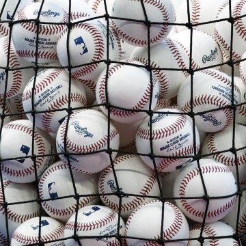 Apr 16, 2024; Miami, Florida, USA;  A bucket of baseballs sits on the field prior to the game between the San Francisco Giants against the Miami Marlins at loanDepot Park. Mandatory Credit: Rhona Wise-USA TODAY Sports