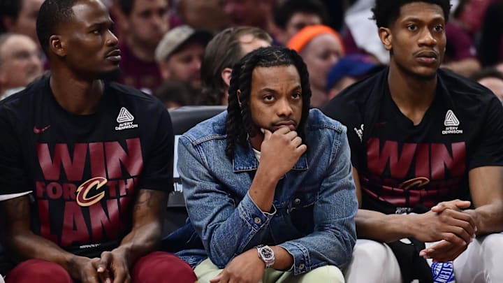 May 4, 2025; Cleveland, Ohio, USA; Cleveland Cavaliers guard Darius Garland, middle, watches from the bench during the first half against the Indiana Pacers in game one of the second round for the 2025 NBA Playoffs at Rocket Arena. Mandatory Credit: Ken Blaze-Imagn Images