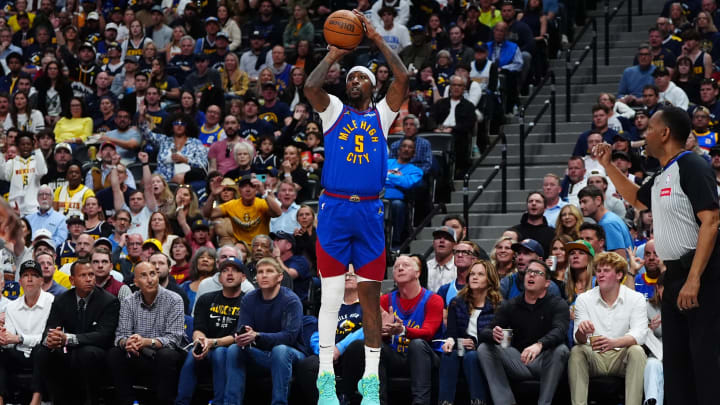 May 4, 2024; Denver, Colorado, USA; Denver Nuggets guard Kentavious Caldwell-Pope (5) shoots the ball in the second half against the Minnesota Timberwolves during game one of the second round for the 2024 NBA playoffs at Ball Arena. Mandatory Credit: Ron Chenoy-USA TODAY Sports