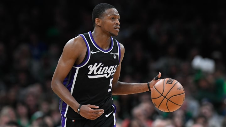 Apr 5, 2024; Boston, Massachusetts, USA; Sacramento Kings guard De'Aaron Fox (5) dribbles the ball against the Boston Celtics during the second half at TD Garden. Mandatory Credit: Eric Canha-USA TODAY Sports