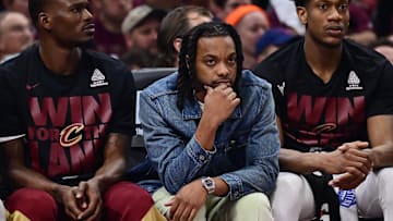 May 4, 2025; Cleveland, Ohio, USA; Cleveland Cavaliers guard Darius Garland, middle, watches from the bench during the first half against the Indiana Pacers in game one of the second round for the 2025 NBA Playoffs at Rocket Arena. Mandatory Credit: Ken Blaze-Imagn Images