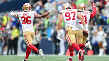 San Francisco 49ers safety Marques Sigle (L), defensive end Nick Bosa (C) and defensive end Sam Okuayinonu (R)
