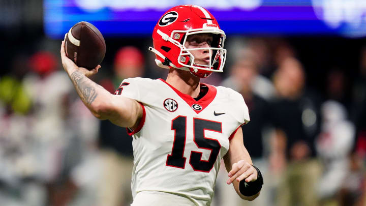 Dec 2, 2023; Atlanta, GA, USA;  Georgia Bulldogs quarterback Carson Beck (15) throws a pass against the Alabama Crimson Tide in the third quarter of the SEC Championship at Mercedes-Benz Stadium.