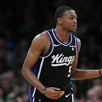 Apr 5, 2024; Boston, Massachusetts, USA; Sacramento Kings guard De'Aaron Fox (5) dribbles the ball against the Boston Celtics during the second half at TD Garden. 