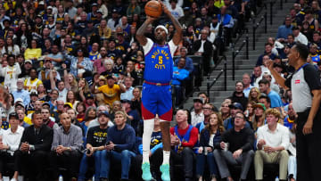 May 4, 2024; Denver, Colorado, USA; Denver Nuggets guard Kentavious Caldwell-Pope (5) shoots the ball in the second half against the Minnesota Timberwolves during game one of the second round for the 2024 NBA playoffs at Ball Arena. Mandatory Credit: Ron Chenoy-USA TODAY Sports