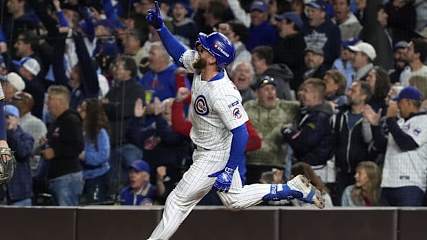 Busch pointing to the sky while he runs the bases after hitting a homer against the Brewer Busch pointing to the sky while he runs the bases after hitting a homer against the Brewer