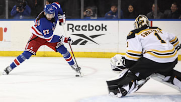 Jan 2, 2025; New York, New York, USA;  Boston Bruins goaltender Jeremy Swayman (1) defends against a shot on goal attempt from New York Rangers center Mika Zibanejad (93) in the second period at Madison Square Garden. Mandatory Credit: Wendell Cruz-Imagn Images