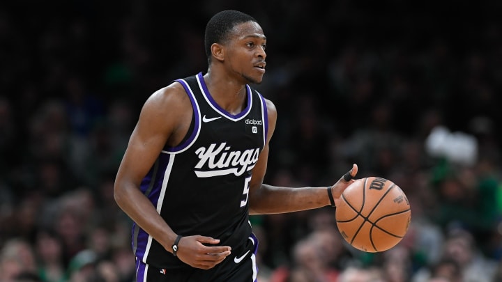 Apr 5, 2024; Boston, Massachusetts, USA; Sacramento Kings guard De'Aaron Fox (5) dribbles the ball against the Boston Celtics during the second half at TD Garden. 