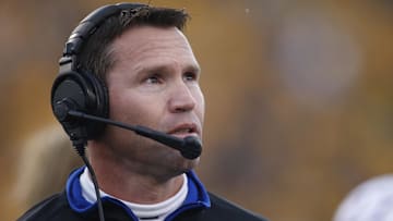 Oct 4, 2014; Morgantown, WV, USA; Kansas Jayhawks interim head coach Clint Bowen on the sidelines against the West Virginia Mountaineers during the second quarter at Milan Puskar Stadium. Mandatory Credit: Charles LeClaire-Imagn Images