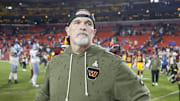 Nov 9, 2025; Landover, Maryland, USA; Washington Commanders head coach Dan Quinn stands on the field following a loss to the Detroit Lions at Northwest Stadium. Mandatory Credit: Peter Casey-Imagn Images