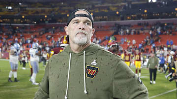 Nov 9, 2025; Landover, Maryland, USA; Washington Commanders head coach Dan Quinn stands on the field following a loss to the Detroit Lions at Northwest Stadium. Mandatory Credit: Peter Casey-Imagn Images