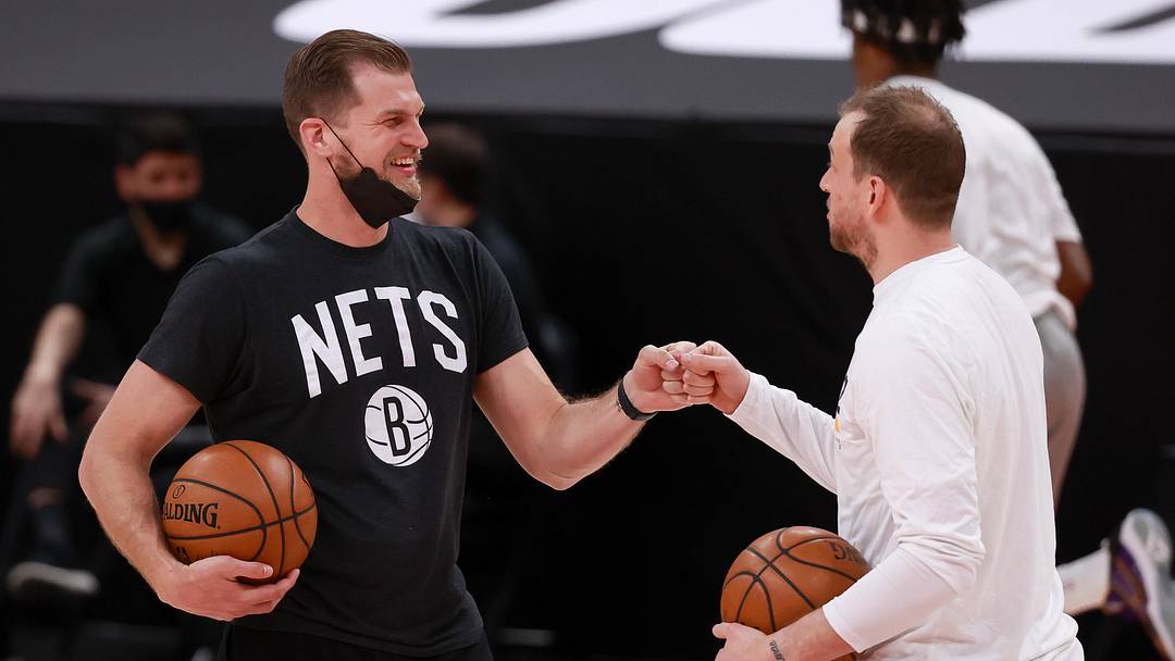 Mar 24, 2021; Salt Lake City, Utah, USA; Brooklyn Nets assistant coach Tiago Splitter and Utah Jazz guard Joe Ingles (2) bump fists before the game at Vivint Smart Home Arena. Mandatory Credit: Chris Nicoll-Imagn Images