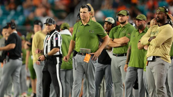 Oct 25, 2025; Miami Gardens, Florida, USA; Miami Hurricanes head coach Mario Cristobal watches from the sideline against the Stanford Cardinal during the fourth quarter at Hard Rock Stadium. Mandatory Credit: Sam Navarro-Imagn Images