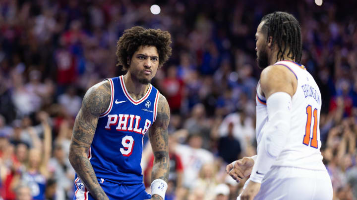 May 2, 2024; Philadelphia, Pennsylvania, USA; Philadelphia 76ers guard Kelly Oubre Jr. (9) reacts in front of New York Knicks guard Jalen Brunson (11) during the second half of game six of the first round for the 2024 NBA playoffs at Wells Fargo Center. Mandatory Credit: Bill Streicher-USA TODAY Sports
