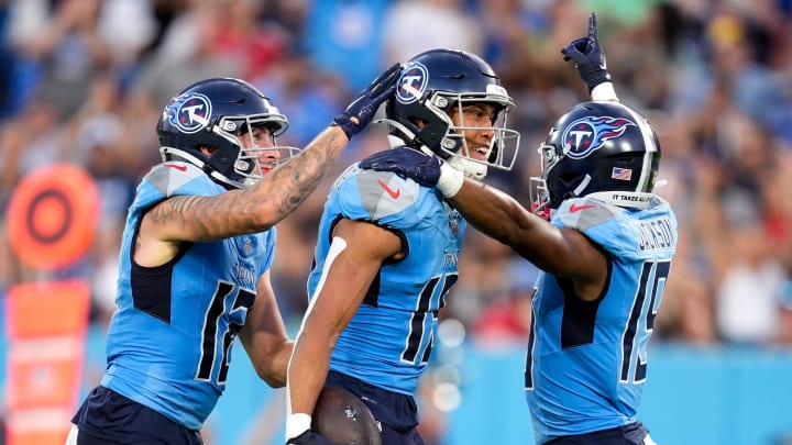 Tennessee Titans wide receiver Nick Westbrook-Ikhine (15) celebrates his touchdown against the Seattle Seahawks with wide receiver Mason Kinsey (12) and wide receiver Jha'Quan Jackson (19) during the second quarter at Nissan Stadium in Nashville, Tenn., Saturday, Aug. 17, 2024.