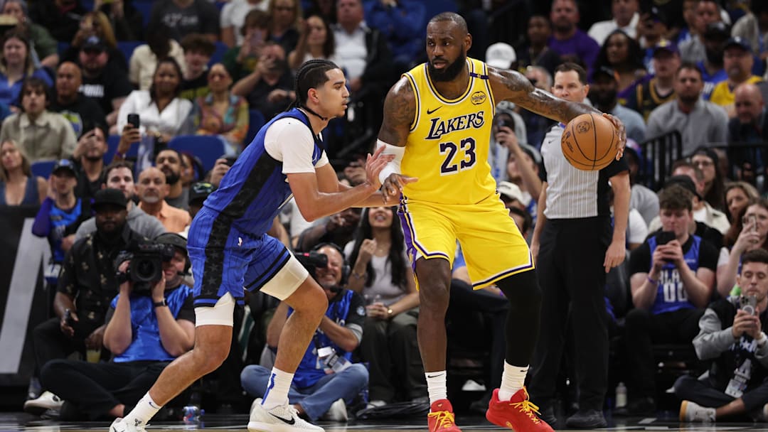 Mar 24, 2025; Orlando, Florida, USA; Los Angeles Lakers forward LeBron James (23) is guarded by Orlando Magic guard Anthony Black (0) in the fourth quarter at Kia Center. Mandatory Credit: Nathan Ray Seebeck-Imagn Images Mar 24, 2025; Orlando, Florida, USA; Los Angeles Lakers forward LeBron James (23) is guarded by Orlando Magic guard Anthony Black (0) in the fourth quarter at Kia Center. Mandatory Credit: Nathan Ray Seebeck-Imagn Images