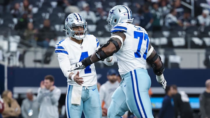 Dallas Cowboys quarterback Dak Prescott greets offensive tackle Tyron Smith before the game against the Philadelphia Eagles at AT&T Stadium. Dallas Cowboys quarterback Dak Prescott greets offensive tackle Tyron Smith before the game against the Philadelphia Eagles at AT&T Stadium.